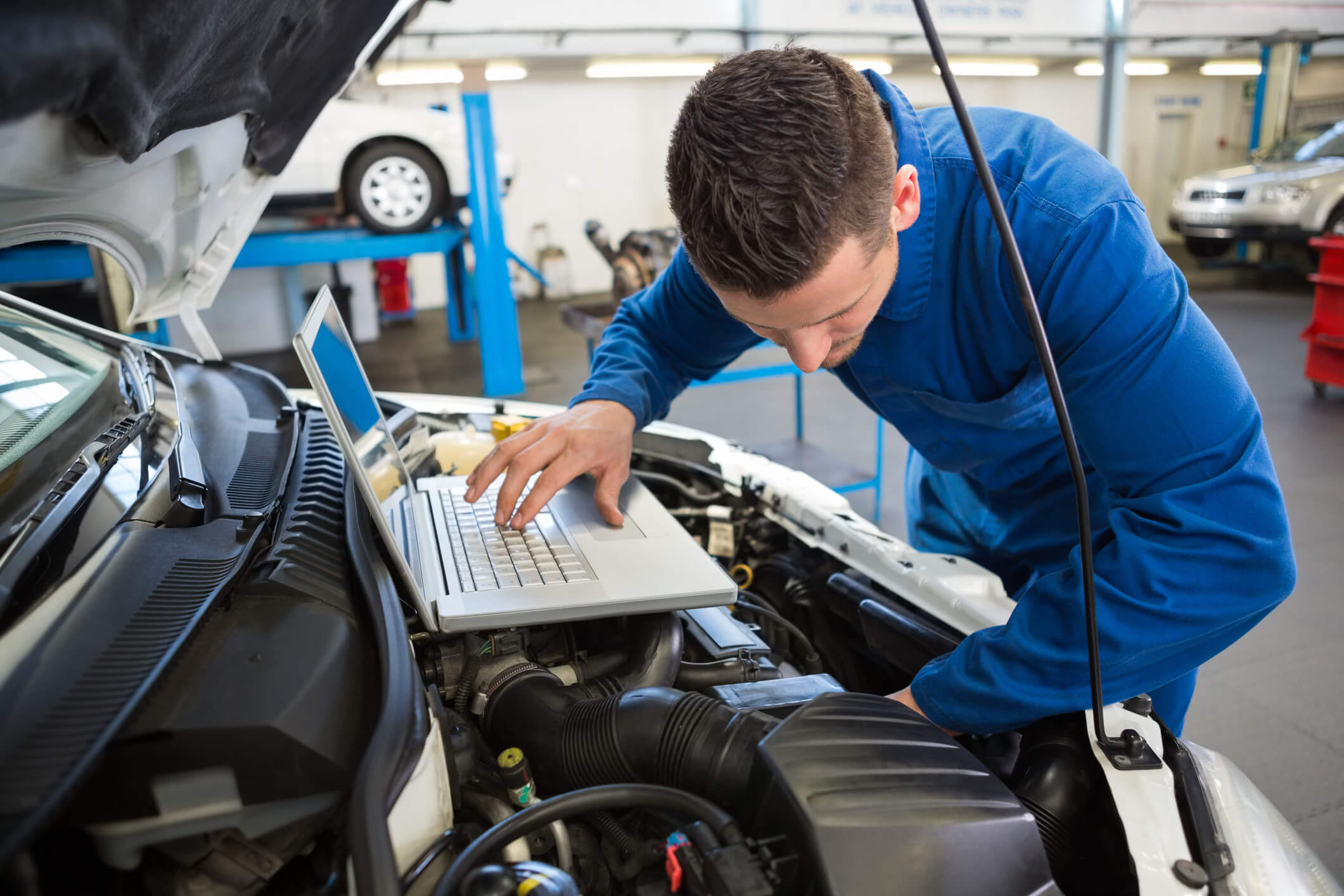 Mechanic using laptop on car Auto Body Repair Shop Knoxville TN